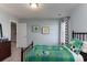 Bright bedroom featuring a twin bed with green soccer themed bedding and neutral grey walls at 153 Stride Ct., Myrtle Beach, SC 29588