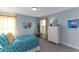 Cozy bedroom featuring yellow accents, a twin bed with blue circle pattern bedding and large windows at 153 Stride Ct., Myrtle Beach, SC 29588