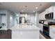 Well-lit kitchen featuring a granite island countertop with ample space for cooking and gathering at 153 Stride Ct., Myrtle Beach, SC 29588