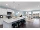 Stylish kitchen with an island, stainless steel appliances, pendant lighting, and a seamless connection to the living area at 153 Stride Ct., Myrtle Beach, SC 29588