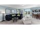 Comfortable living room with a plush sectional, accent chairs, and scenic views from the windows at 153 Stride Ct., Myrtle Beach, SC 29588