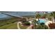 Aerial view of a pool and gazebo with marsh views and waterway access on a sunny day at 1582 South Waccamaw Dr. # 56, Garden City Beach, SC 29576