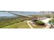 Scenic aerial view of a waterway with marsh, gazebo, pool, and surrounding landscape at 1582 South Waccamaw Dr. # 56, Garden City Beach, SC 29576