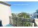Balcony view showing the surrounding neighborhood and palm trees at 1582 South Waccamaw Dr. # 56, Garden City Beach, SC 29576