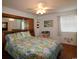 Relaxing bedroom featuring wood flooring and coordinating comforter and decor at 1582 South Waccamaw Dr. # 56, Garden City Beach, SC 29576
