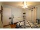 Cozy bedroom featuring light blue walls, ceiling fan, and a white dresser, providing a calm living space at 1582 South Waccamaw Dr. # 56, Garden City Beach, SC 29576