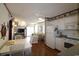 Open concept kitchen and dining area features white cabinets and appliances plus a sliding glass door at 1582 South Waccamaw Dr. # 56, Garden City Beach, SC 29576