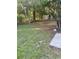 Backyard with grass and trees, along with a small outbuilding along the fence at 1676 Citadel Ln., Myrtle Beach, SC 29577