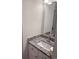 Bathroom vanity with a patterned granite countertop, white sink, and modern faucet at 1676 Citadel Ln., Myrtle Beach, SC 29577