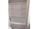 A bright white tub and shower combination with built in shelving for toiletries at 1676 Citadel Ln., Myrtle Beach, SC 29577