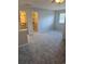 Spacious bedroom with soft carpet, ceiling fan and closet leading to an en suite bathroom at 1676 Citadel Ln., Myrtle Beach, SC 29577
