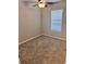 An empty bedroom features neutral carpet, ceiling fan, and a window with blinds at 1676 Citadel Ln., Myrtle Beach, SC 29577