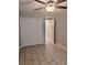 Vacant bedroom showcases tile flooring, a ceiling fan, and a double door closet at 1676 Citadel Ln., Myrtle Beach, SC 29577
