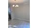 A dining room with tiled floors and classic chandelier next to the updated kitchen at 1676 Citadel Ln., Myrtle Beach, SC 29577