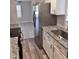 Modern kitchen featuring stainless steel appliances and granite countertops, adjacent to the living area at 1676 Citadel Ln., Myrtle Beach, SC 29577
