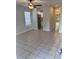 The living room features tile flooring, a modern ceiling fan, and neutral paint tones at 1676 Citadel Ln., Myrtle Beach, SC 29577