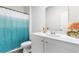 Bathroom featuring a vanity with a white countertop, ample lighting, and a colorful shower curtain at 1704 Perthshire Loop, Myrtle Beach, SC 29579