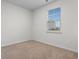 Spare bedroom showcasing a window, carpeted floors, and neutral colors at 1704 Perthshire Loop, Myrtle Beach, SC 29579