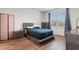 Modern bedroom with a queen bed, window and tasteful decor at 1704 Perthshire Loop, Myrtle Beach, SC 29579