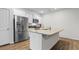 Spacious kitchen with stainless steel appliances, granite countertops, and a central island with a sink at 1704 Perthshire Loop, Myrtle Beach, SC 29579