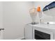 Modern laundry room includes a washer and dryer, and a storage shelf at 1704 Perthshire Loop, Myrtle Beach, SC 29579