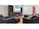 Cozy living room with a large entertainment center, sectional sofa, and accent chairs at 1704 Perthshire Loop, Myrtle Beach, SC 29579