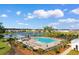 A relaxing community pool with plenty of lounge chairs and a view of the lake at 1704 Perthshire Loop, Myrtle Beach, SC 29579
