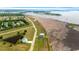 Aerial view showcasing the property's location near a pond and marsh with ocean view in distance at 1716 Cravens St., Georgetown, SC 29440