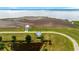Aerial view of two houses with a large pond between them and ocean in the distance at 1716 Cravens St., Georgetown, SC 29440