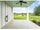 Covered back porch with a peaceful view of the pond and greenery at 1716 Cravens St., Georgetown, SC 29440