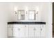Bathroom featuring double sinks, large mirrors, and wall sconces at 1716 Cravens St., Georgetown, SC 29440