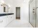 Bathroom featuring white cabinets, tile floors, and a glass enclosed shower at 1716 Cravens St., Georgetown, SC 29440