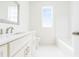 Bathroom featuring white cabinets and a tub with shower at 1716 Cravens St., Georgetown, SC 29440