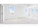 Bright bedroom featuring two large windows and a ceiling fan for comfort at 1716 Cravens St., Georgetown, SC 29440