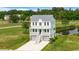 Charming two-story home with a gray roof, a white facade, a balcony, and an inviting staircase at 1716 Cravens St., Georgetown, SC 29440