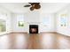 Bright living room with a fireplace, ceiling fan, and a glass door with great view at 1716 Cravens St., Georgetown, SC 29440