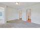 Bright, carpeted bedroom showcasing an ensuite bathroom and walk-in closet for ultimate convenience at 182 Foxford Dr., Conway, SC 29526