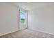 Bright bedroom with neutral carpet and white walls, filled with natural light from a large window at 182 Foxford Dr., Conway, SC 29526