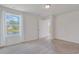 Inviting bedroom with carpet, a large bright window overlooking a pond, and ensuite bathroom and walk-in closet at 182 Foxford Dr., Conway, SC 29526