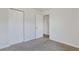 Neutral bedroom featuring neutral walls, a closet, carpet, and an open doorway at 182 Foxford Dr., Conway, SC 29526