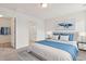 Well-lit bedroom with a neatly made bed and an open closet, creating a serene and organized living space at 182 Foxford Dr., Conway, SC 29526