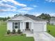 Charming single-story home with white siding, manicured lawn, and inviting front entrance at 182 Foxford Dr., Conway, SC 29526