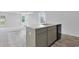 Kitchen island offers breakfast bar seating, ample storage, and sink with modern fixtures at 182 Foxford Dr., Conway, SC 29526