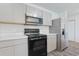 Modern kitchen featuring stainless steel appliances, grey cabinets, white marble counter tops, and a black range oven at 182 Foxford Dr., Conway, SC 29526