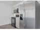Close-up of the sleek stainless steel refrigerator complementing the contemporary kitchen design at 182 Foxford Dr., Conway, SC 29526