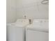 Functional laundry room featuring a white washer and dryer with a shelf at 182 Foxford Dr., Conway, SC 29526