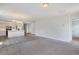 Bright living room featuring neutral carpet, gray walls, open floor plan to kitchen at 182 Foxford Dr., Conway, SC 29526