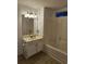 Well-lit bathroom boasts a vanity with storage and a shower-tub combination at 197 Charter Dr. # D1, Longs, SC 29568