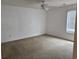 Bright bedroom with neutral walls, plush carpet, and a ceiling fan at 197 Charter Dr. # D1, Longs, SC 29568