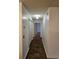 Hallway with tile flooring, neutral paint, and closet storage at 197 Charter Dr. # D1, Longs, SC 29568